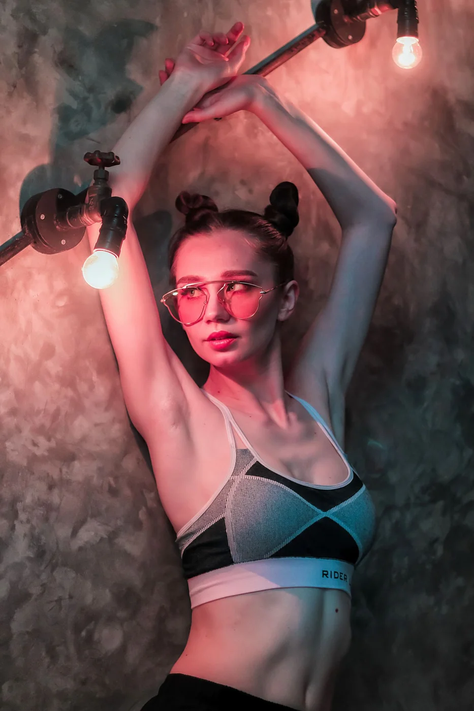 Exercise top worn during a dumbbell movement