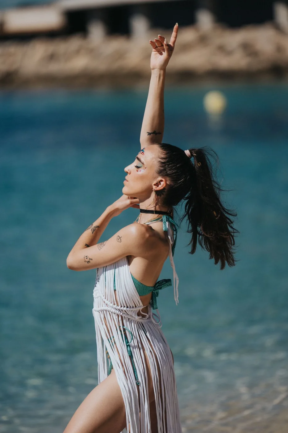 Side View of a Woman in a Bikini an a Beach Cover Up