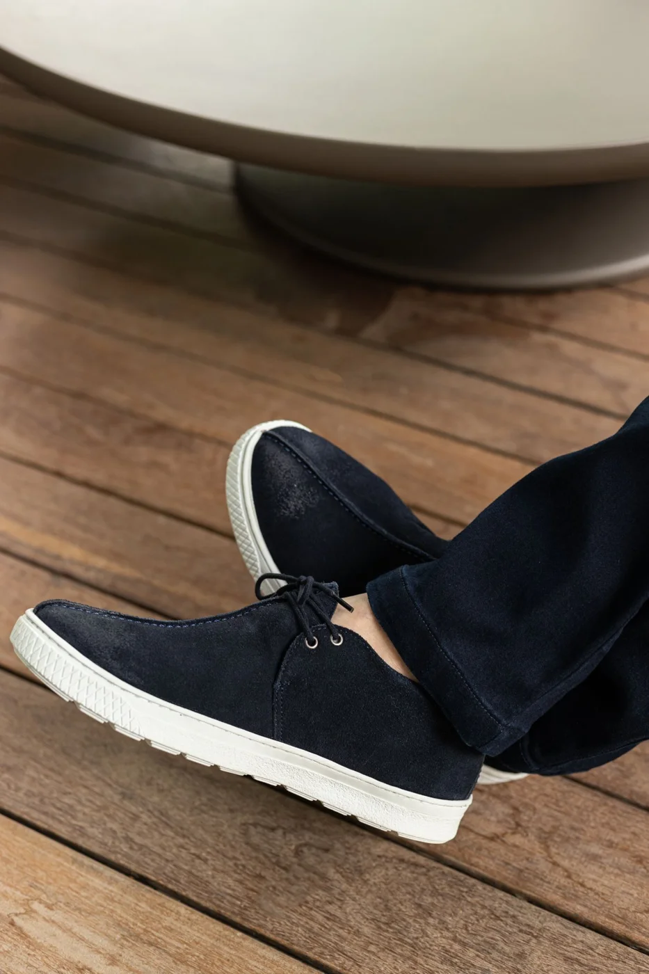 A Person Wearing Black Suede Shoes