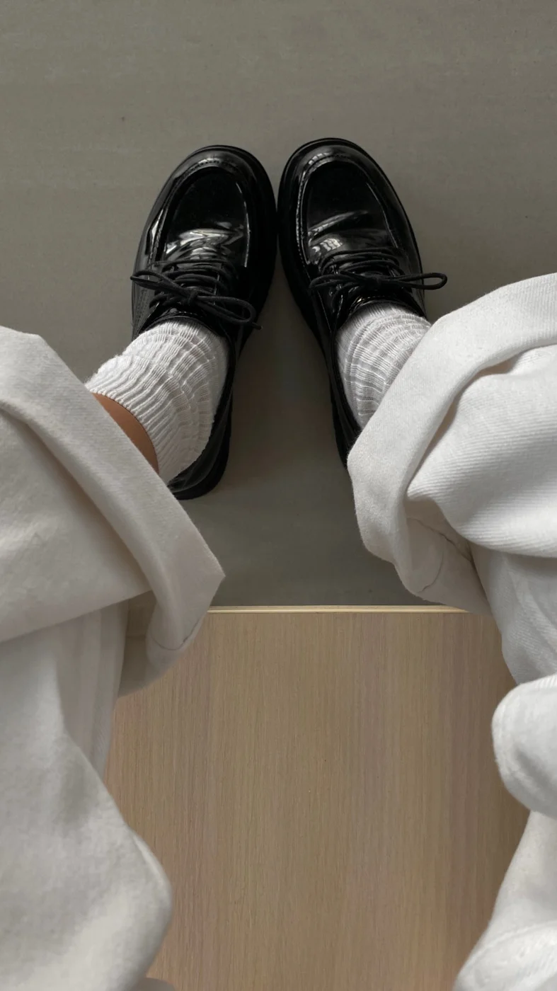 Shoes being worn with socks