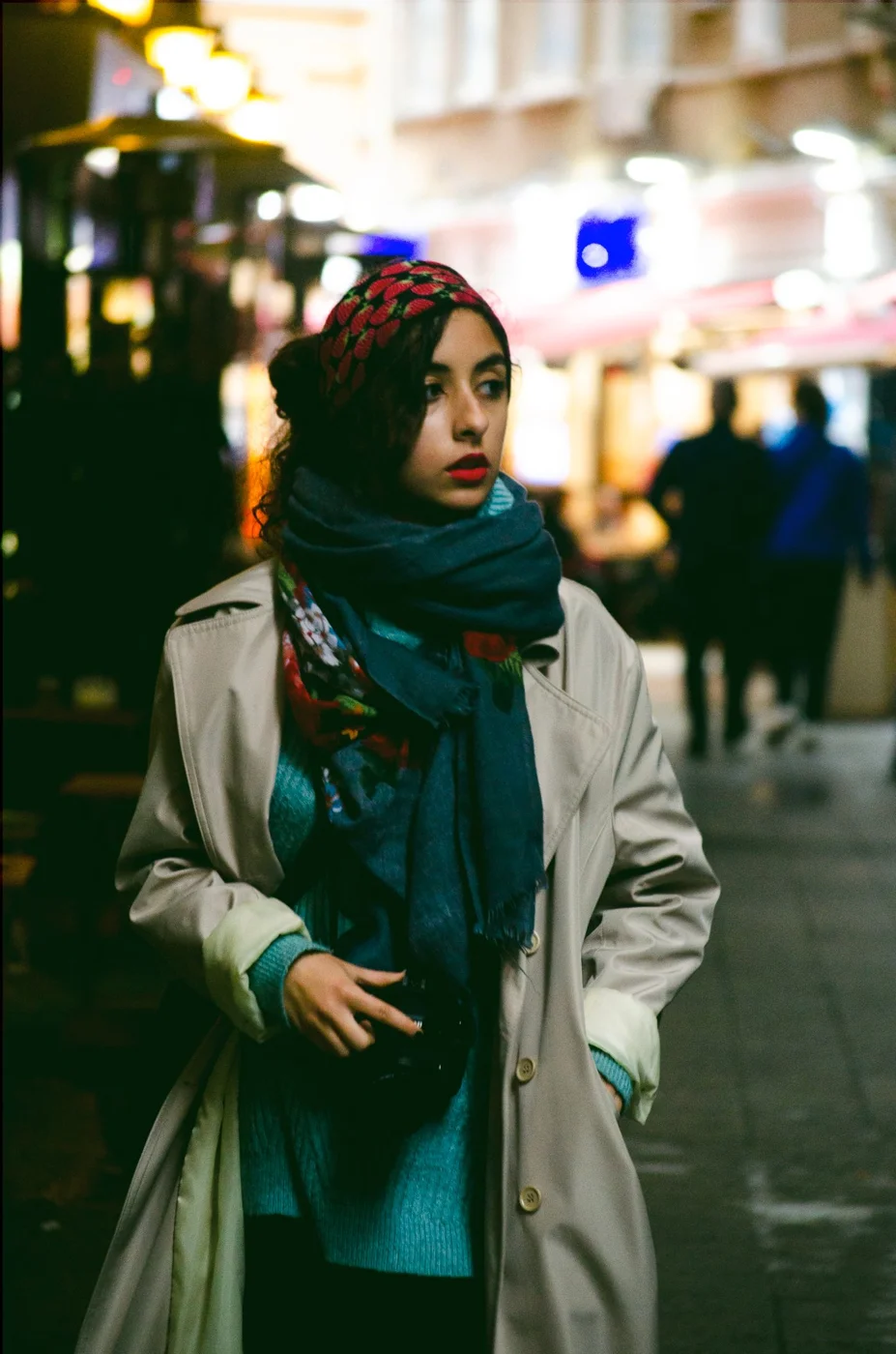Woman Wearing a Coat and Scarf Around her Neck