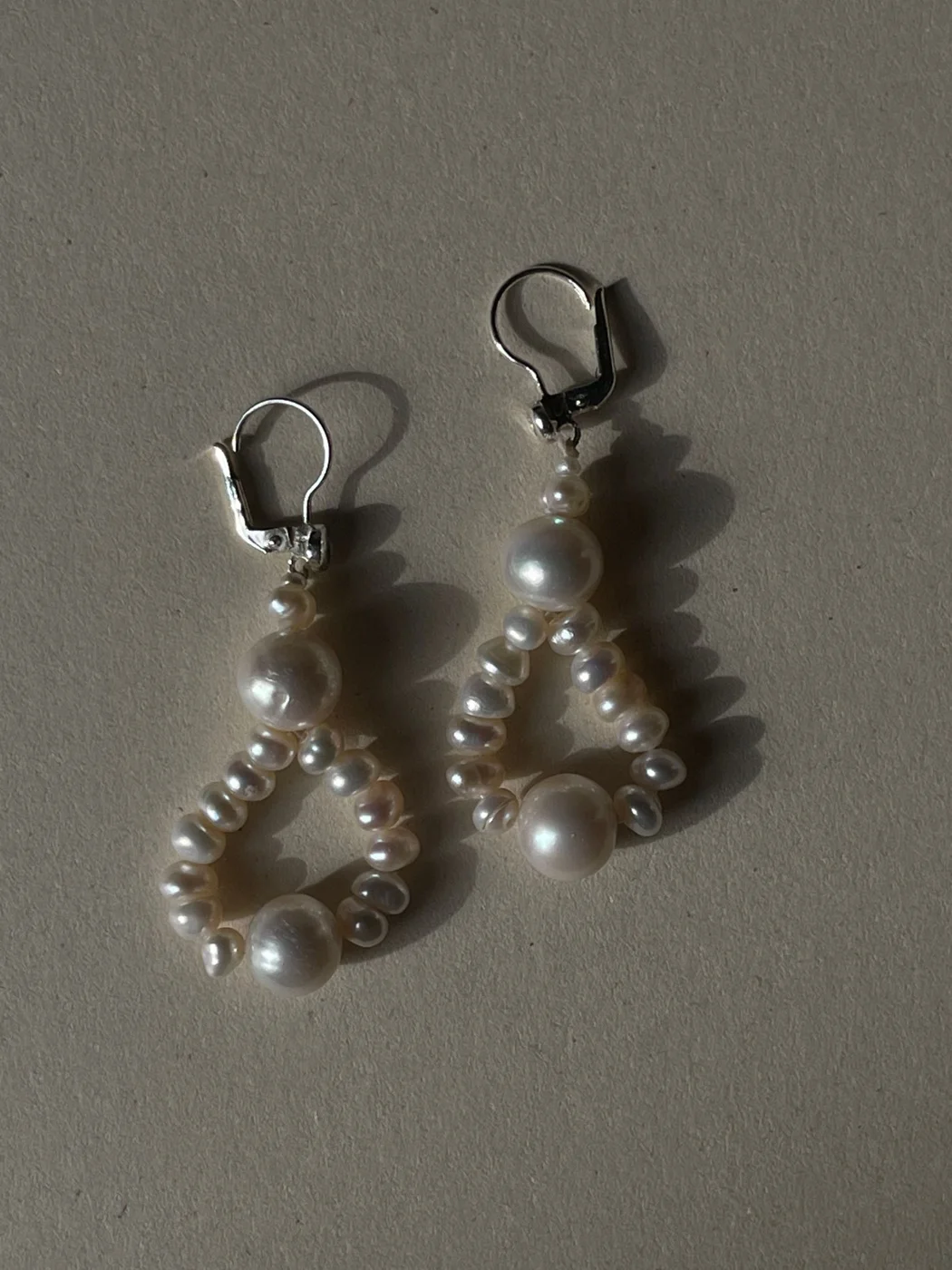 Earrings on White Surface