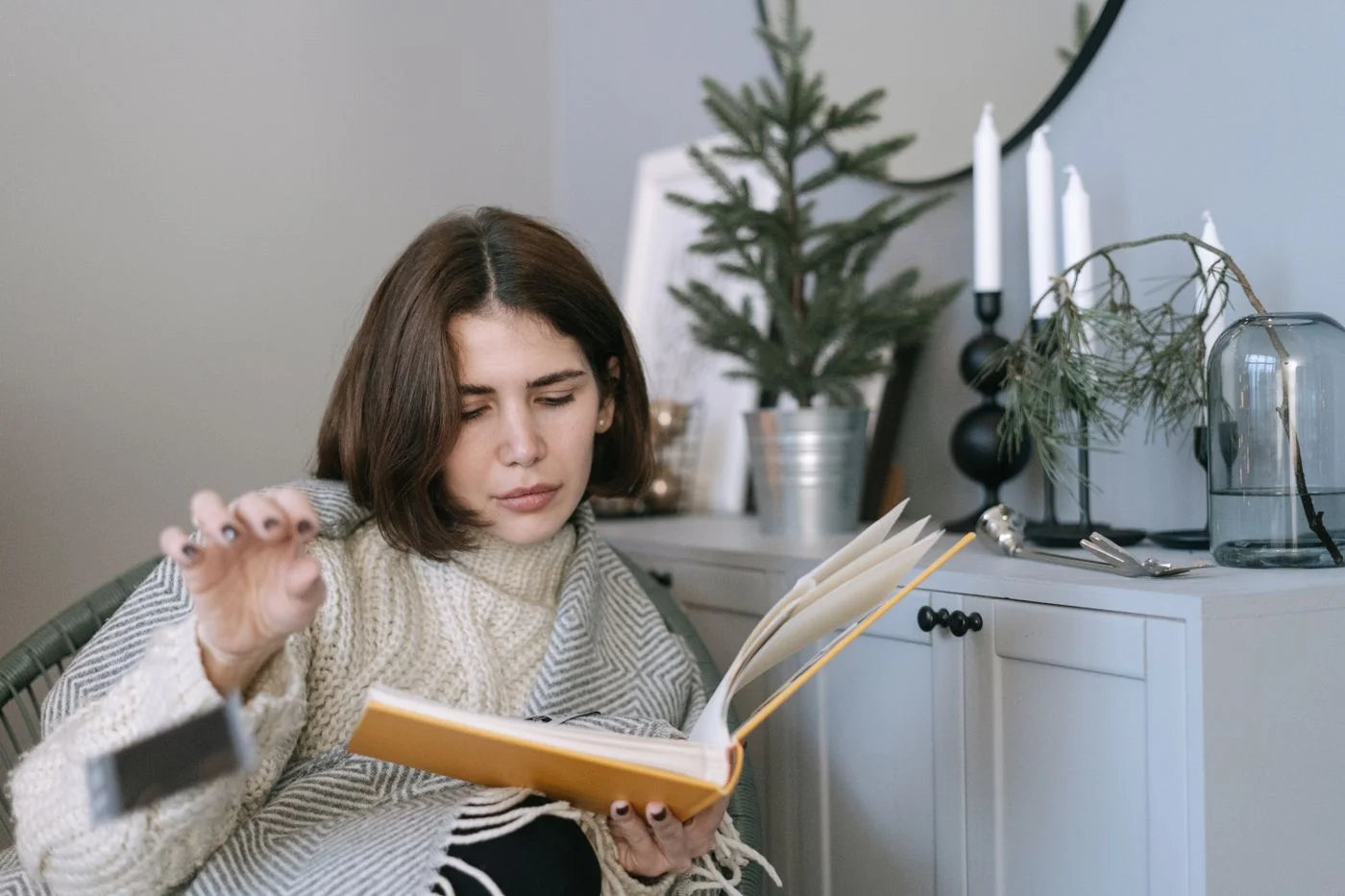 A knitted sweater worn while reading