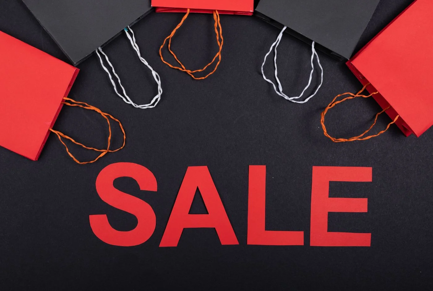 Sale lettering and paper shopping bags