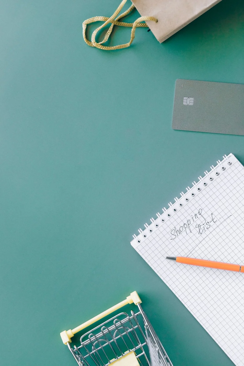 Spiral Notebook on Green Table