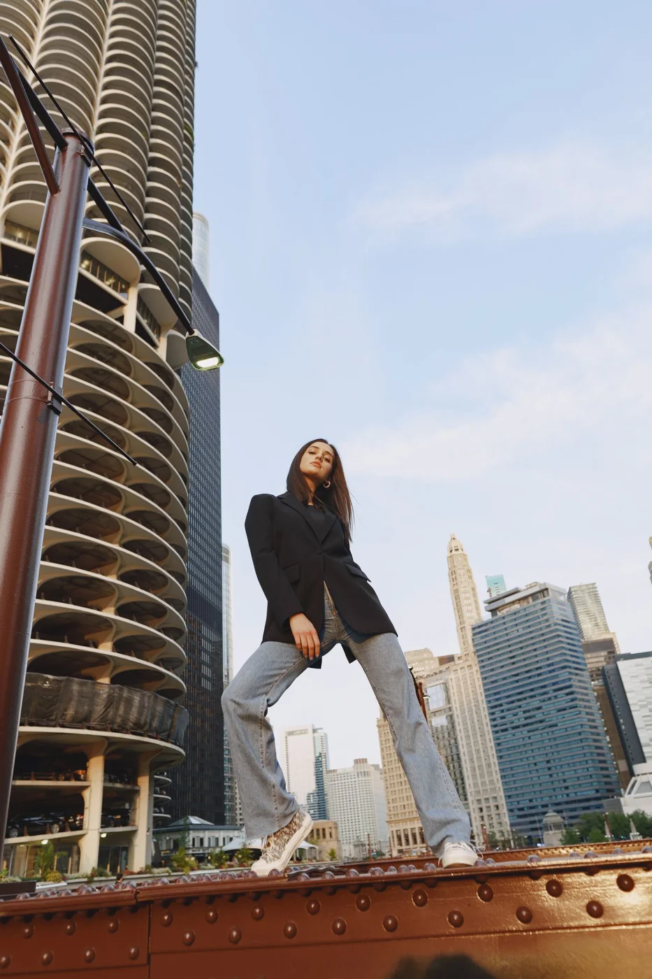 Woman wearing a blazer and loose jeans