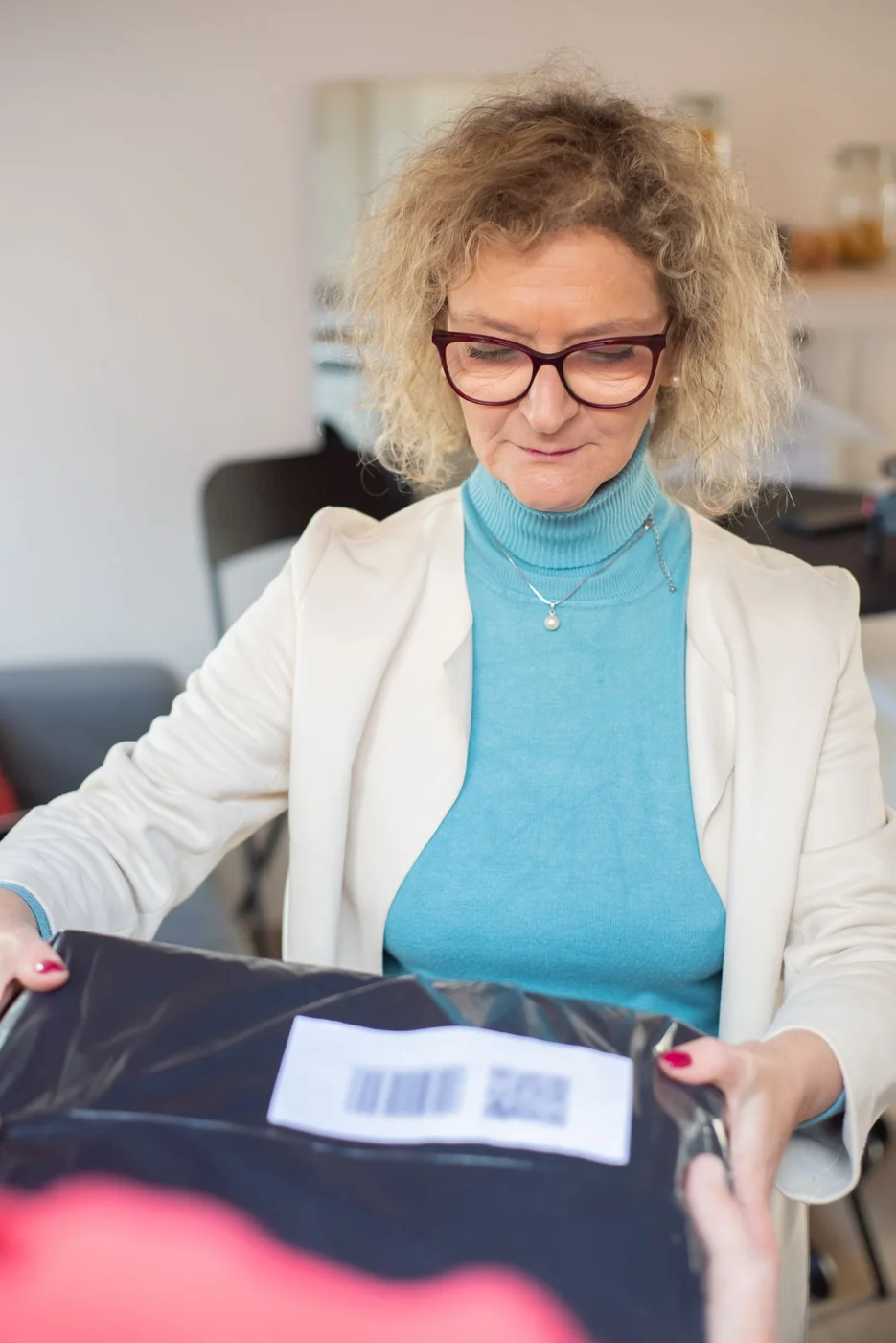 Customer examining a delivered parcel